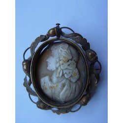 Cameo on precious stone with gold frame and pin on the back.