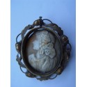 Cameo on precious stone with gold frame and pin on the back.