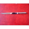 Antique letter opener with silver handle.