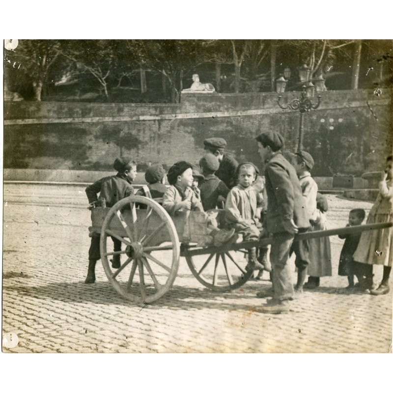 Artistic photography. Children playing with a wagon.